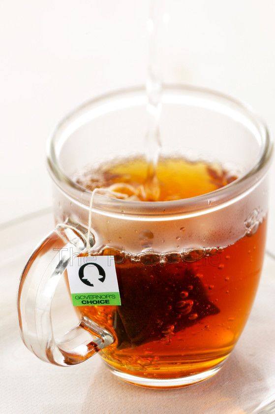 teabag brewing in glass mug